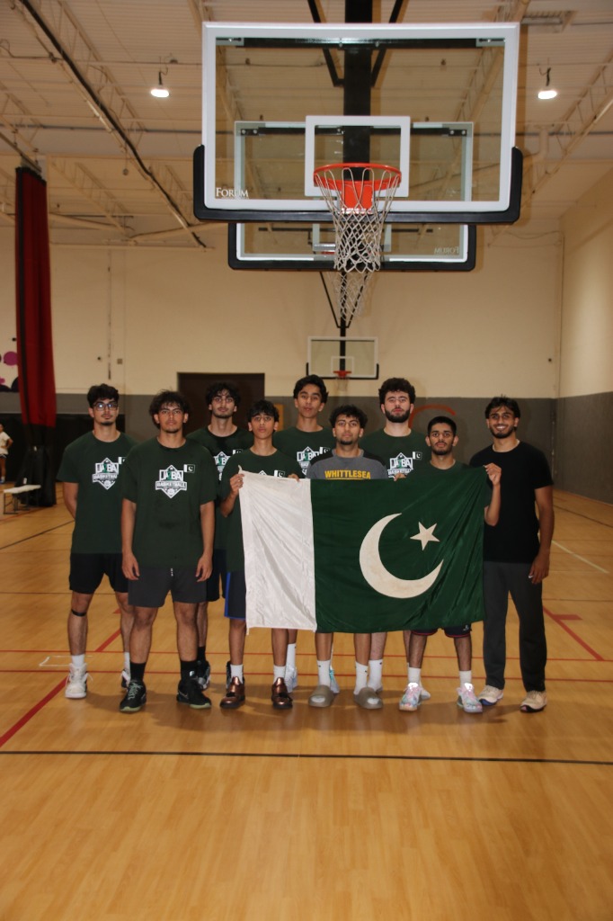 Jazba Basketball AAU team posing together on the court