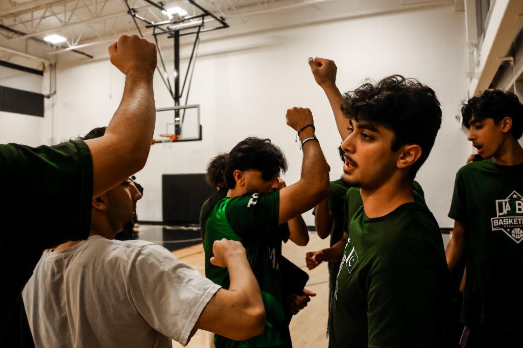 Jazba Basketball team huddle during a tournament